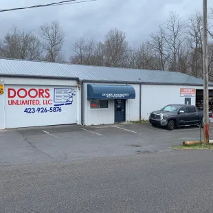 Doors Unlimited LLC logo