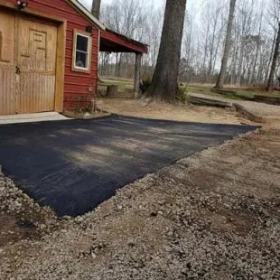 E Wells Paving logo