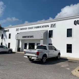 Emerald Coast Fabrication logo