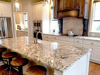 Evolve Granite and Natural Stone logo