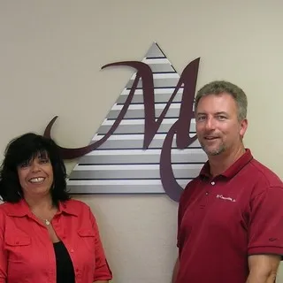 May Construction, Inc. logo