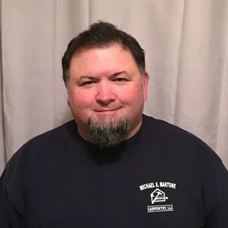 Michael E Martone Carpentry logo