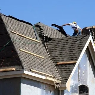 Reliance Roofing Inc. logo