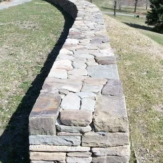 Rick Burntitus Stone Masonry logo