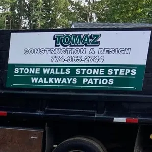 Tomaz Construction and Design logo