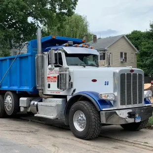Toms Paving & Masonry Services logo