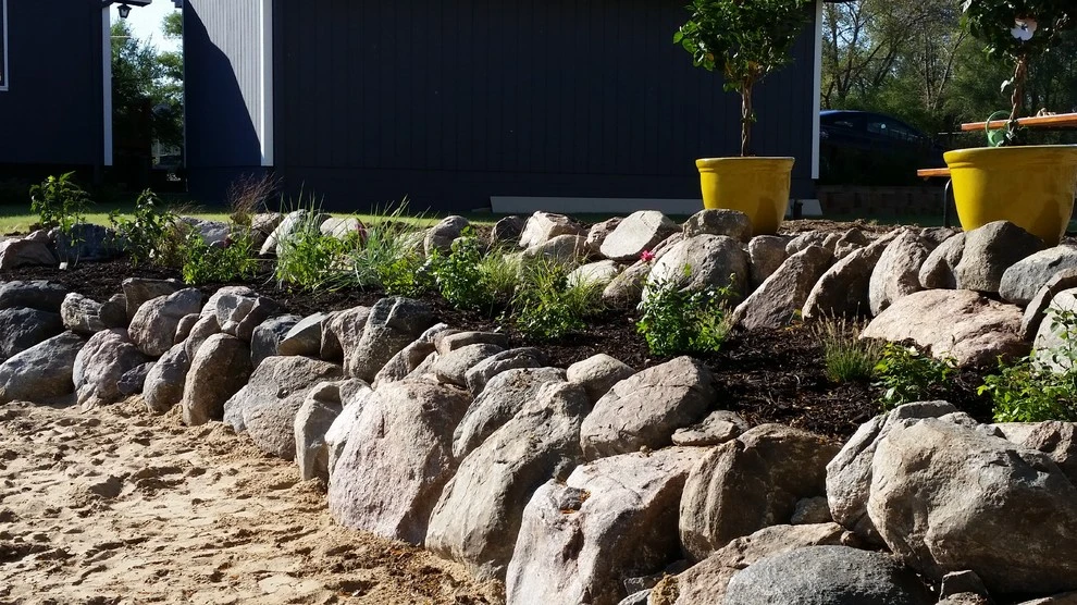 Boulder Retaining Wall by Above And Beyond Complete Grounds Maintenance - Photo 9