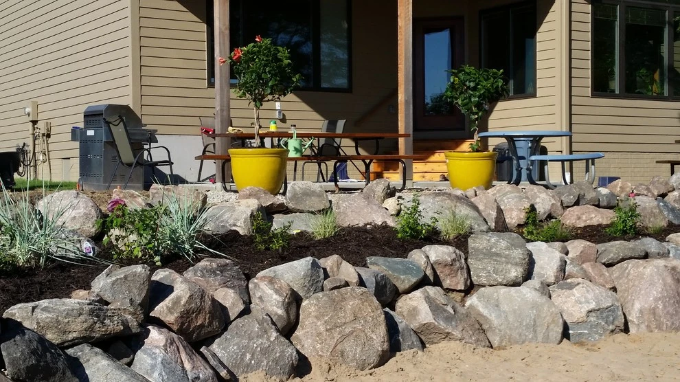 Boulder Retaining Wall by Above And Beyond Complete Grounds Maintenance - Photo 7