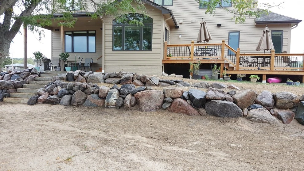Boulder Retaining Wall by Above And Beyond Complete Grounds Maintenance - Photo 6