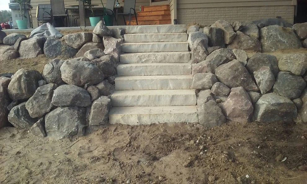 Boulder Retaining Wall by Above And Beyond Complete Grounds Maintenance - Photo 3