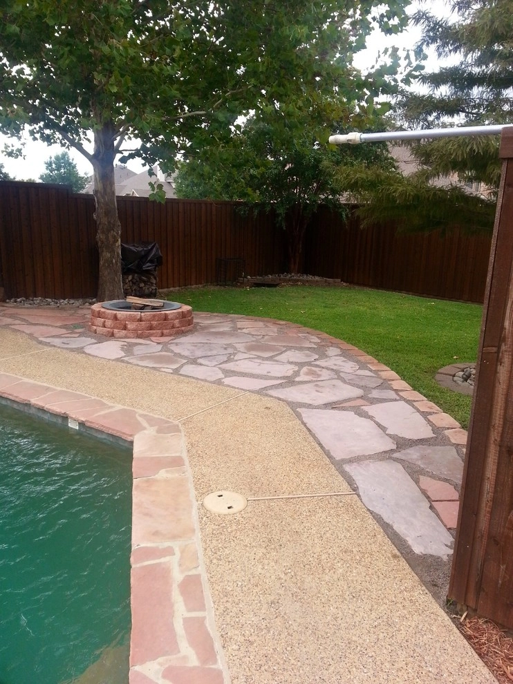 Pool hardscape expansion with fire pit by Absolutely Bushed Landscaping - Photo 7