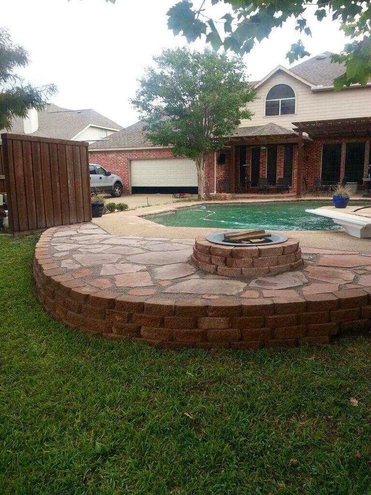 Pool hardscape expansion with fire pit by Absolutely Bushed Landscaping - Photo 2