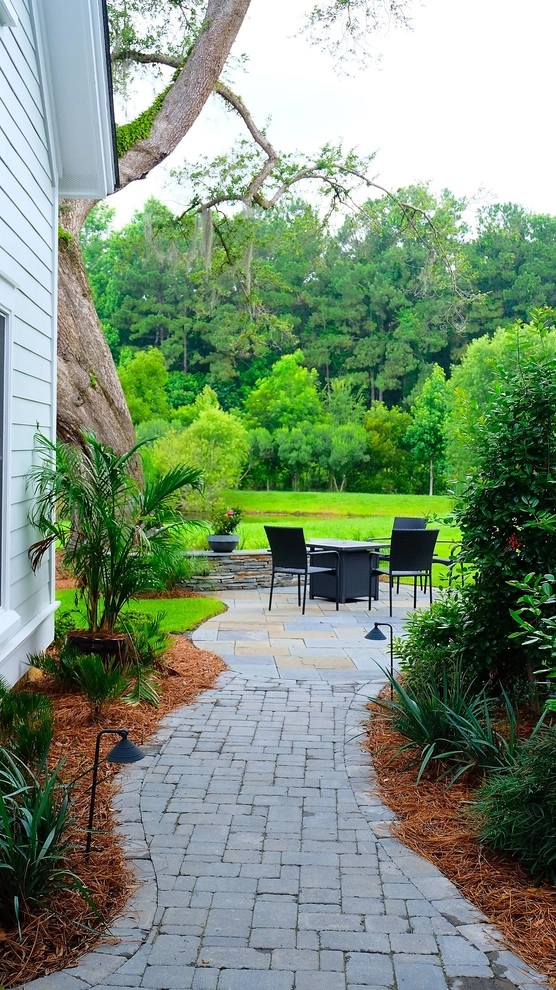 Blue stone patio and pond view by Green Grass Landscape Contractors - Photo 2