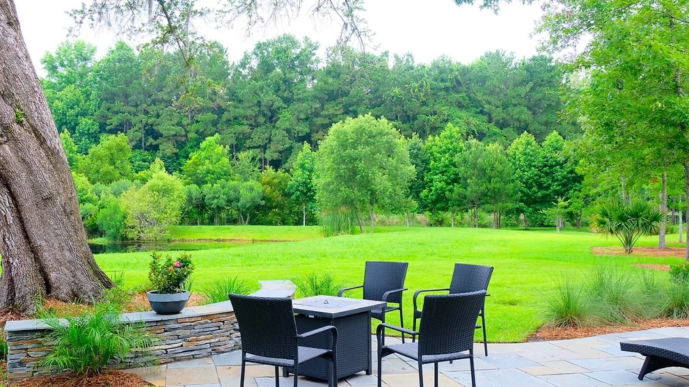 Blue stone patio and pond view by Green Grass Landscape Contractors - Photo 17