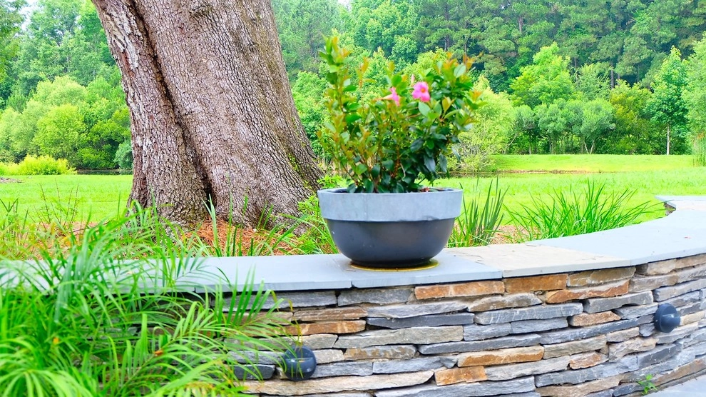 Blue stone patio and pond view by Green Grass Landscape Contractors - Photo 10