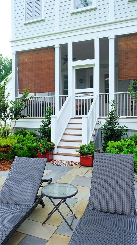 Blue stone patio and pond view by Green Grass Landscape Contractors - Photo 13