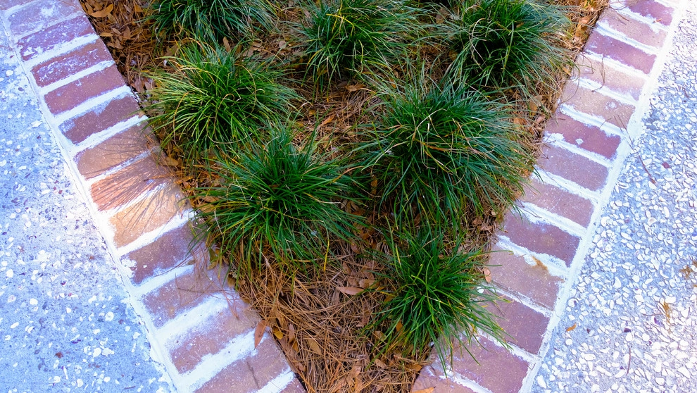 Stately tabby and brick by Green Grass Landscape Contractors - Photo 2