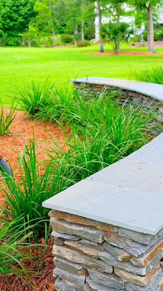 Blue stone patio and pond view by Green Grass Landscape Contractors - Photo 11