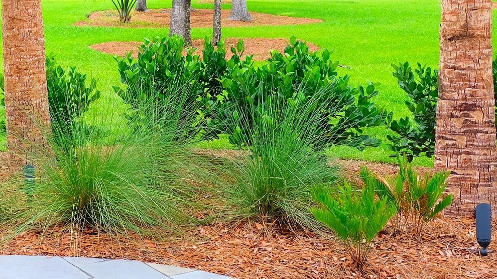 Blue stone patio and pond view by Green Grass Landscape Contractors - Photo 15