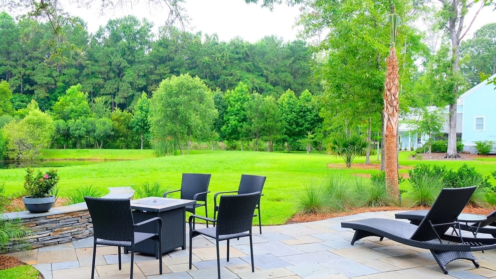 Blue stone patio and pond view by Green Grass Landscape Contractors - Photo 3