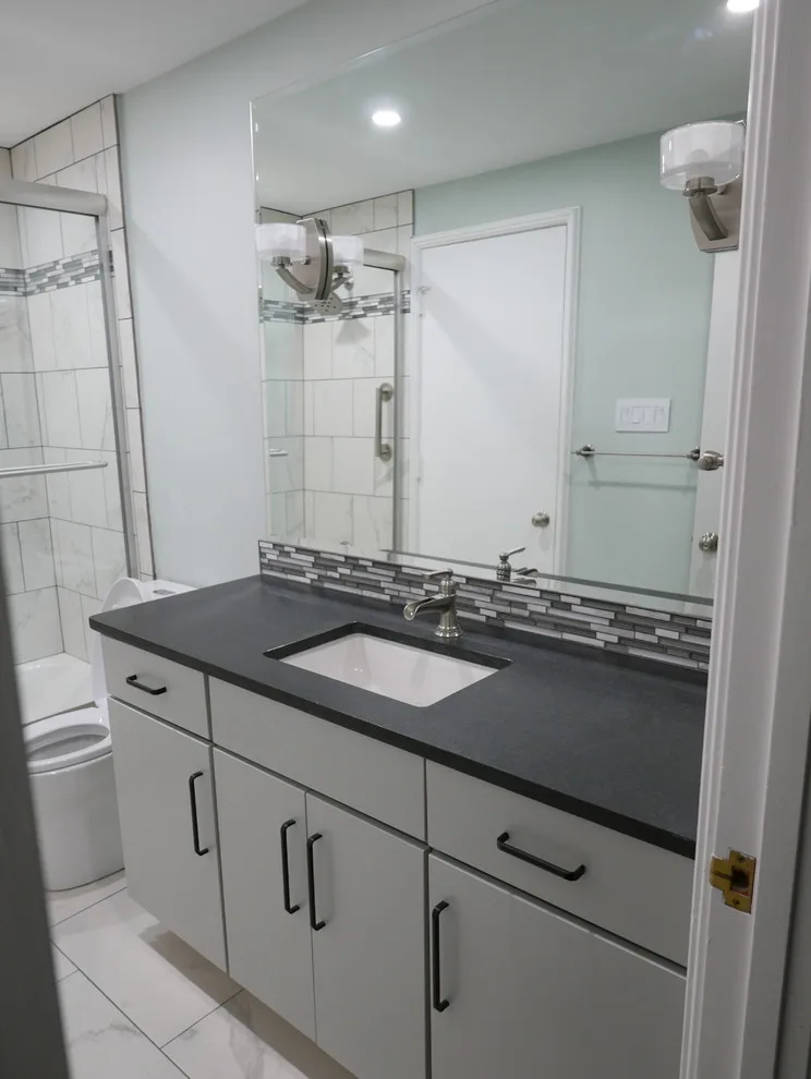 Baronne Hall Restroom by Before And After Builders, Inc. - Photo 7