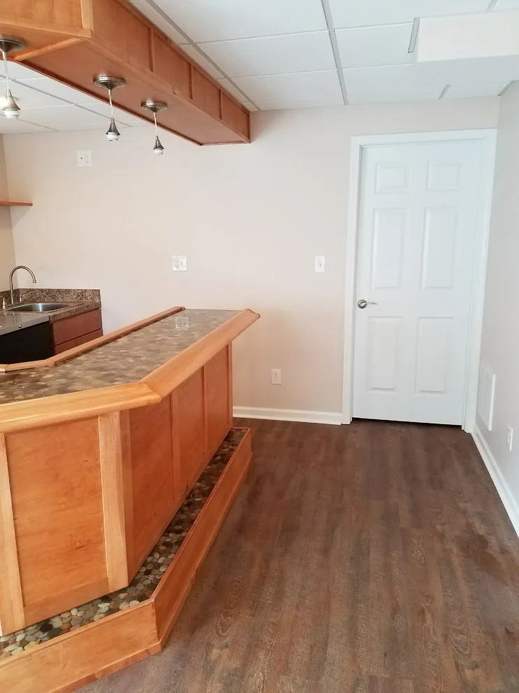 Basement renovation featuring a bar by Southerland Construction & Renovation, LLC - Photo 6