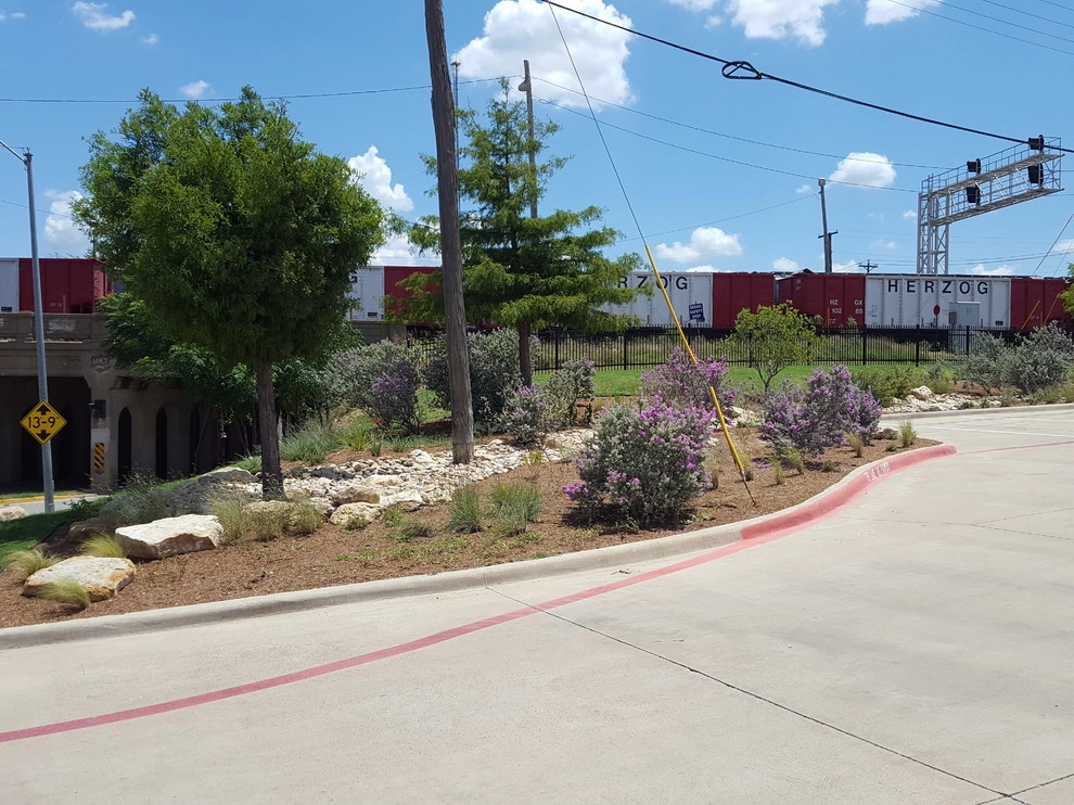 Drought tolerant landscaping with dry creek bed by Happy Gardens - Photo 13