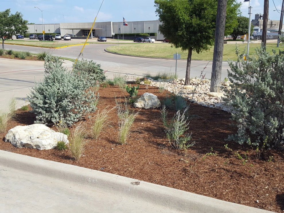 Drought tolerant landscaping with dry creek bed by Happy Gardens - Photo 10