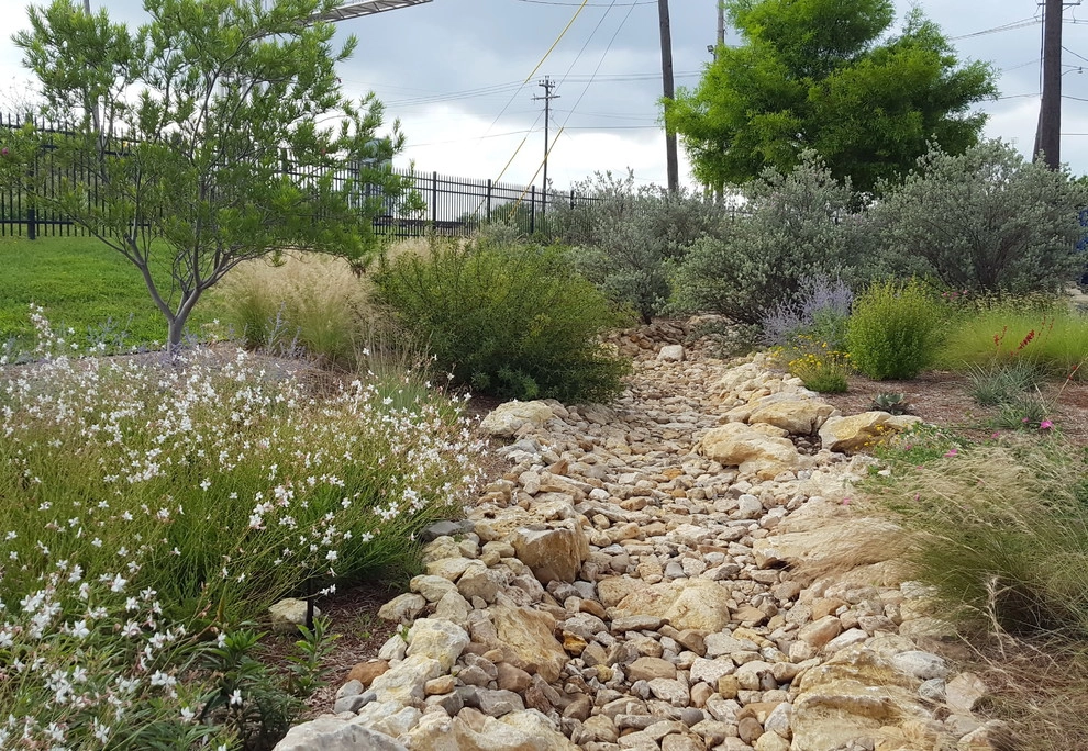 Drought tolerant landscaping with dry creek bed by Happy Gardens - Photo 20