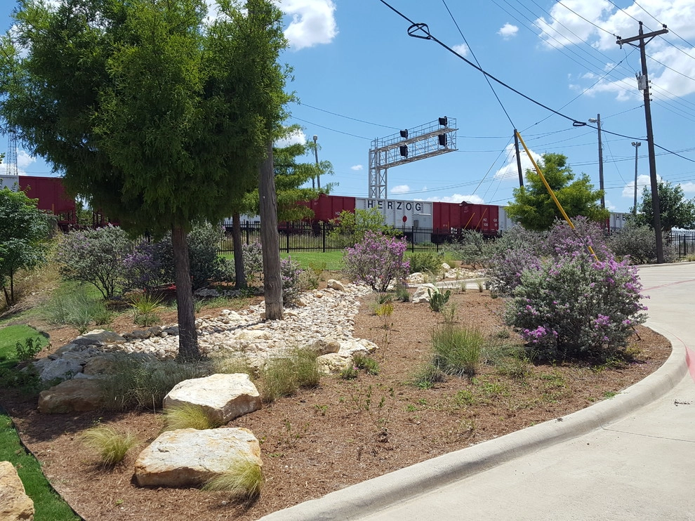 Drought tolerant landscaping with dry creek bed by Happy Gardens - Photo 18