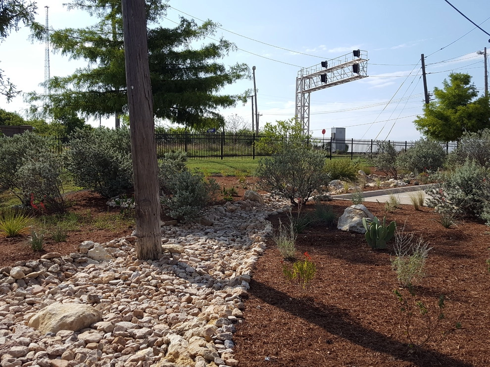 Drought tolerant landscaping with dry creek bed by Happy Gardens - Photo 8