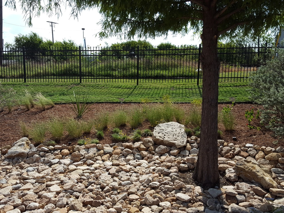Drought tolerant landscaping with dry creek bed by Happy Gardens - Photo 26