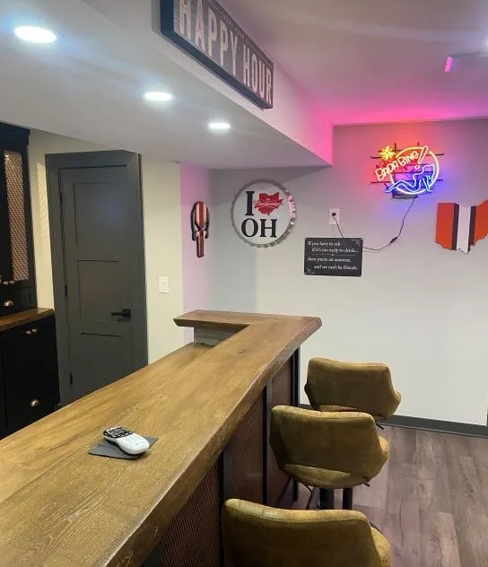 Basement Renovation featuring a bar and game area by Casino Co. Renovations - Photo 11