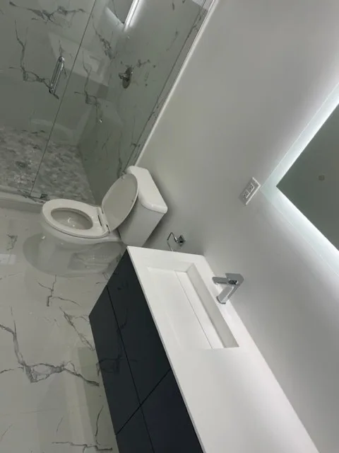 Restroom Renovations by One Stop Construction - Photo 27