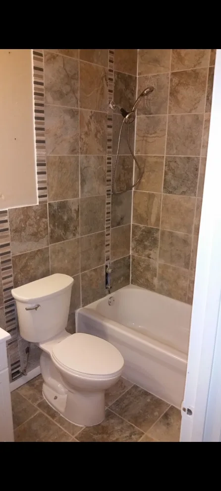 Restroom Renovation by Construction One - Photo 13