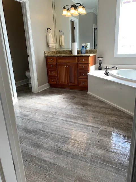 Restroom Tile Upgrade by Rainwater Builders - Photo 2