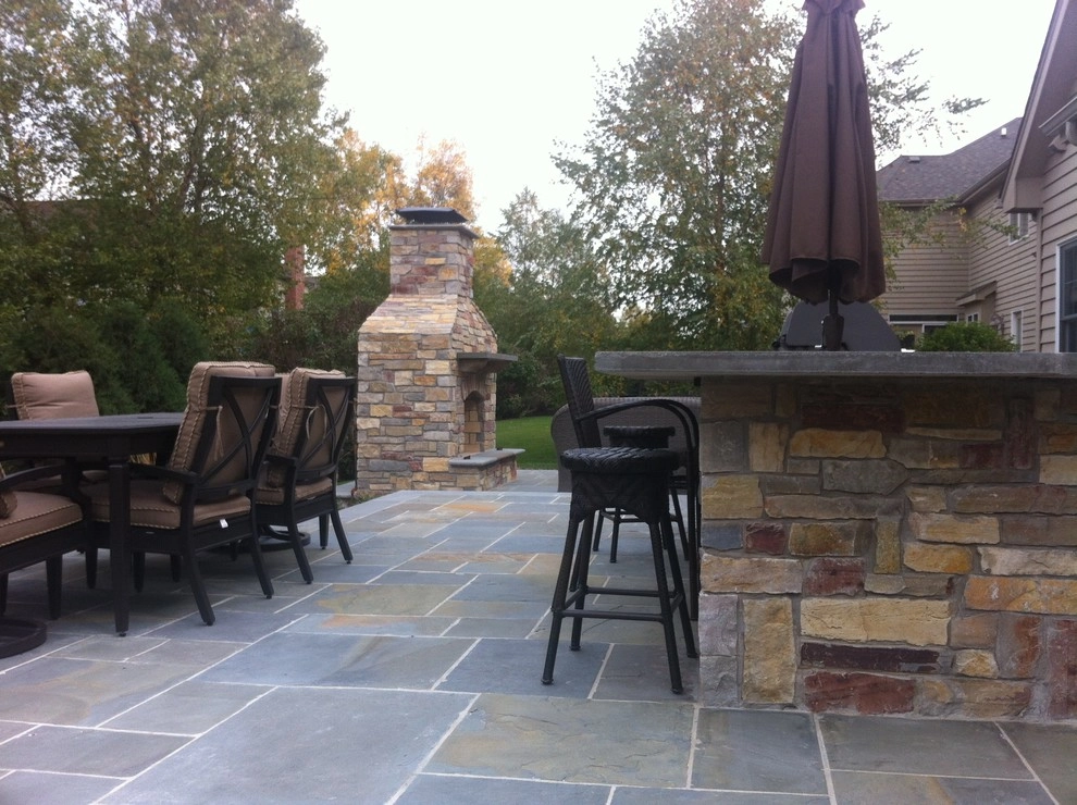 Naperville bluestone patio, outdoor kitchen, and fireplace by Hively Landscaping Inc. - Photo 3