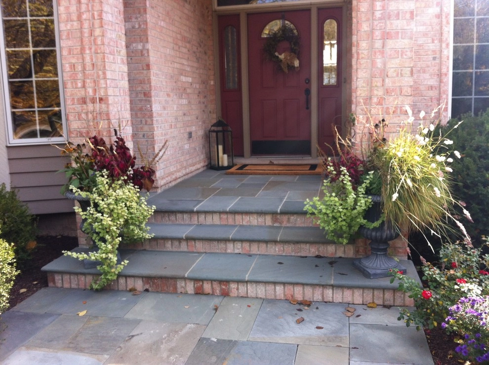 Bluestone and Brick Paving with Boulder Walls by Hively Landscaping Inc. - Photo 7