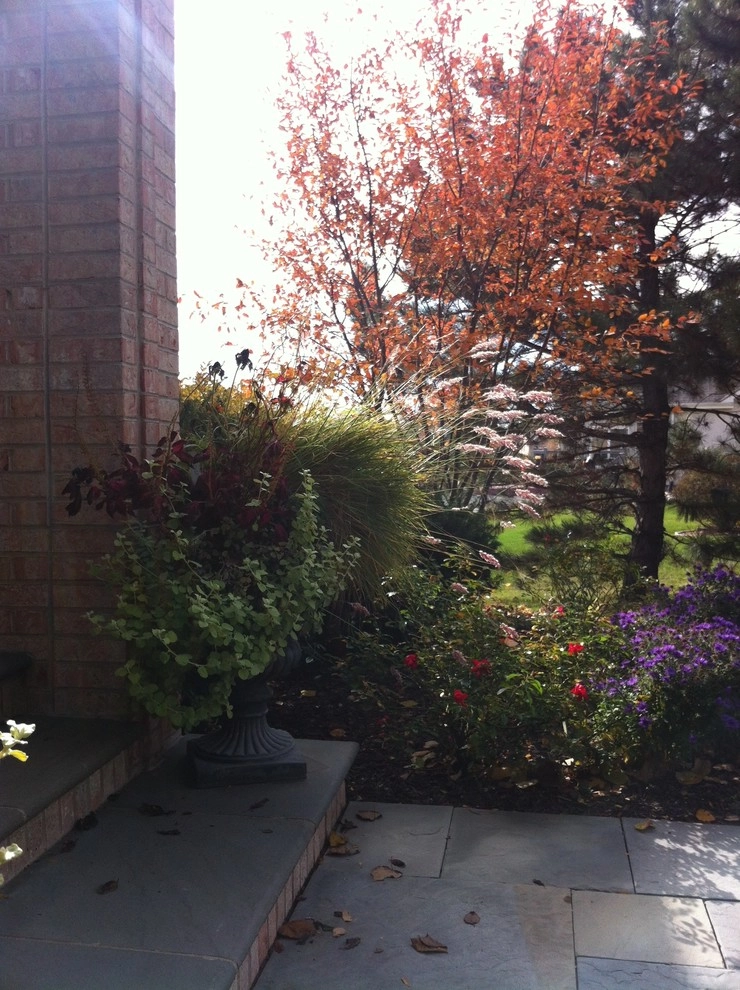 Bluestone and Brick Paving with Boulder Walls by Hively Landscaping Inc. - Photo 8