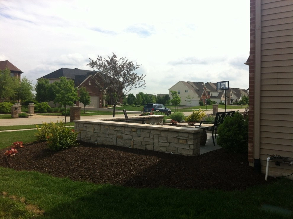 Bluestone Patio with Limestone Veneer Seat Wall by Hively Landscaping Inc. - Photo 5