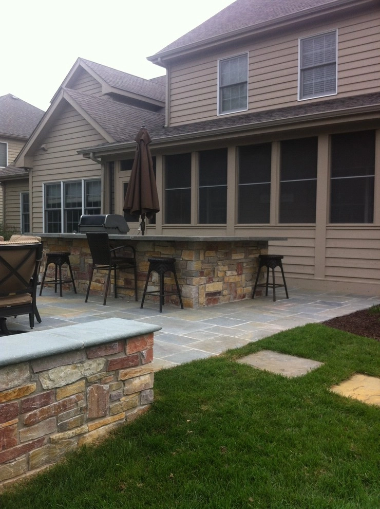 Naperville bluestone patio, outdoor kitchen, and fireplace by Hively Landscaping Inc. - Photo 6