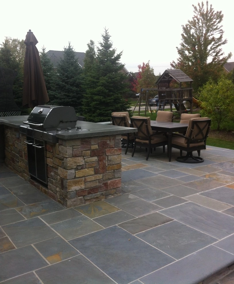 Naperville bluestone patio, outdoor kitchen, and fireplace by Hively Landscaping Inc. - Photo 4