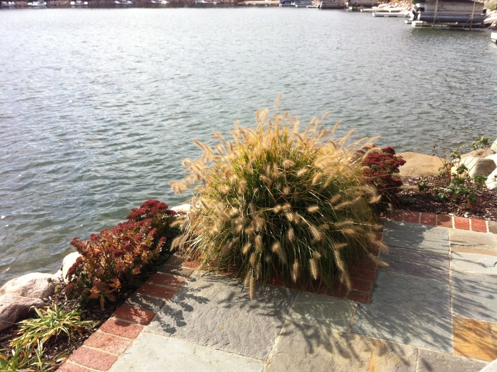 Bluestone and Brick Paving with Boulder Walls by Hively Landscaping Inc. - Photo 9