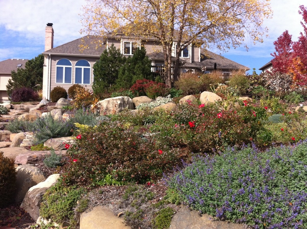 Bluestone and Brick Paving with Boulder Walls by Hively Landscaping Inc. - Photo 11