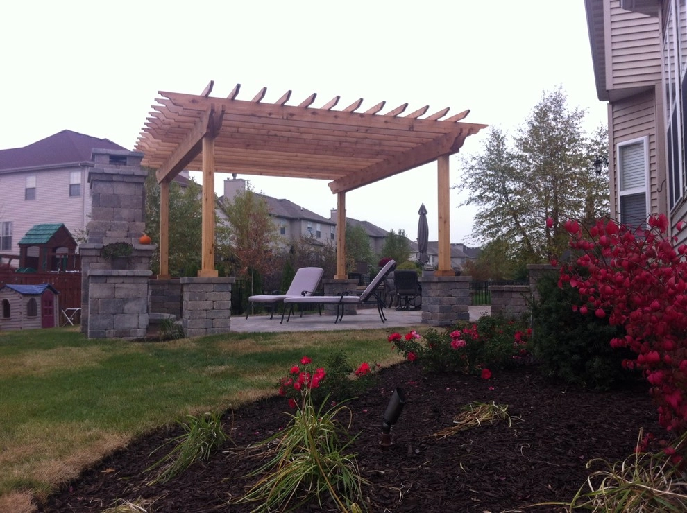 Paver patio with fireplace and pergola by Hively Landscaping Inc. - Photo 4