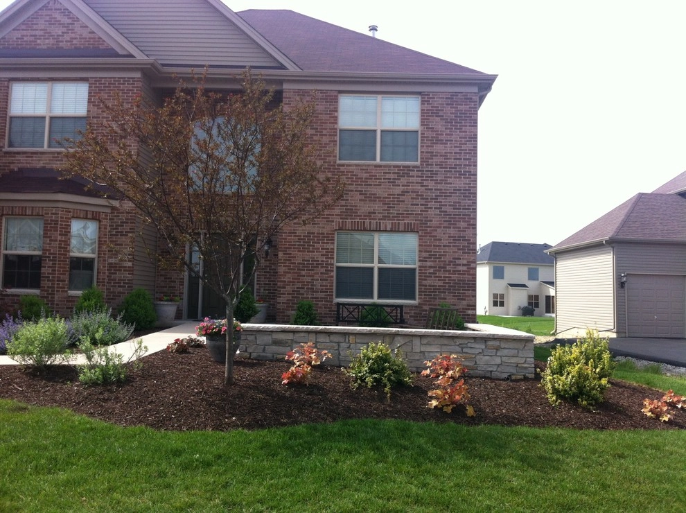 Bluestone Patio with Limestone Veneer Seat Wall by Hively Landscaping Inc. - Photo 4
