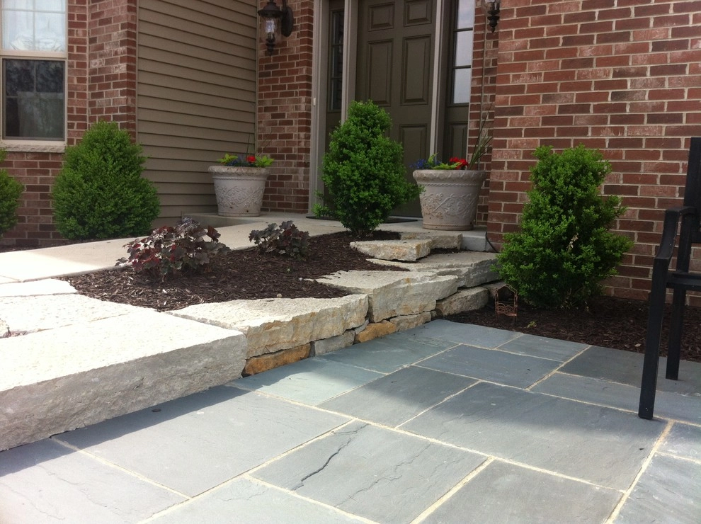 Bluestone Patio with Limestone Veneer Seat Wall by Hively Landscaping Inc. - Photo 6