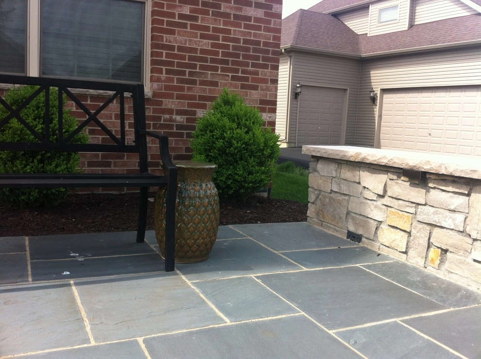 Bluestone Patio with Limestone Veneer Seat Wall by Hively Landscaping Inc. - Photo 2