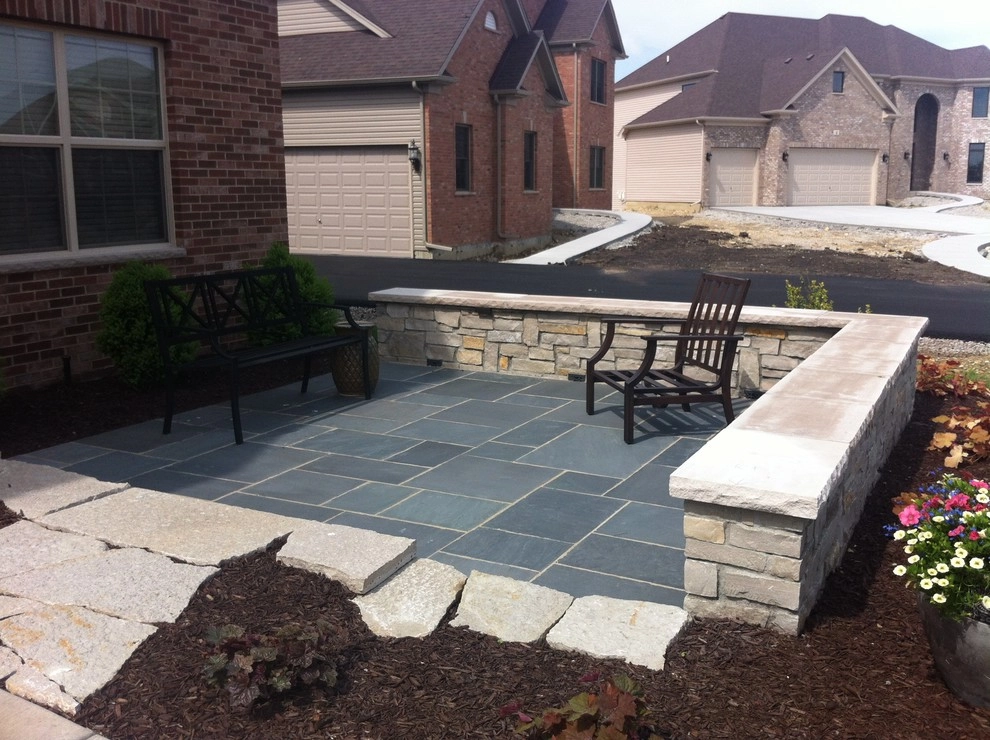 Bluestone Patio with Limestone Veneer Seat Wall by Hively Landscaping Inc. - Photo 3