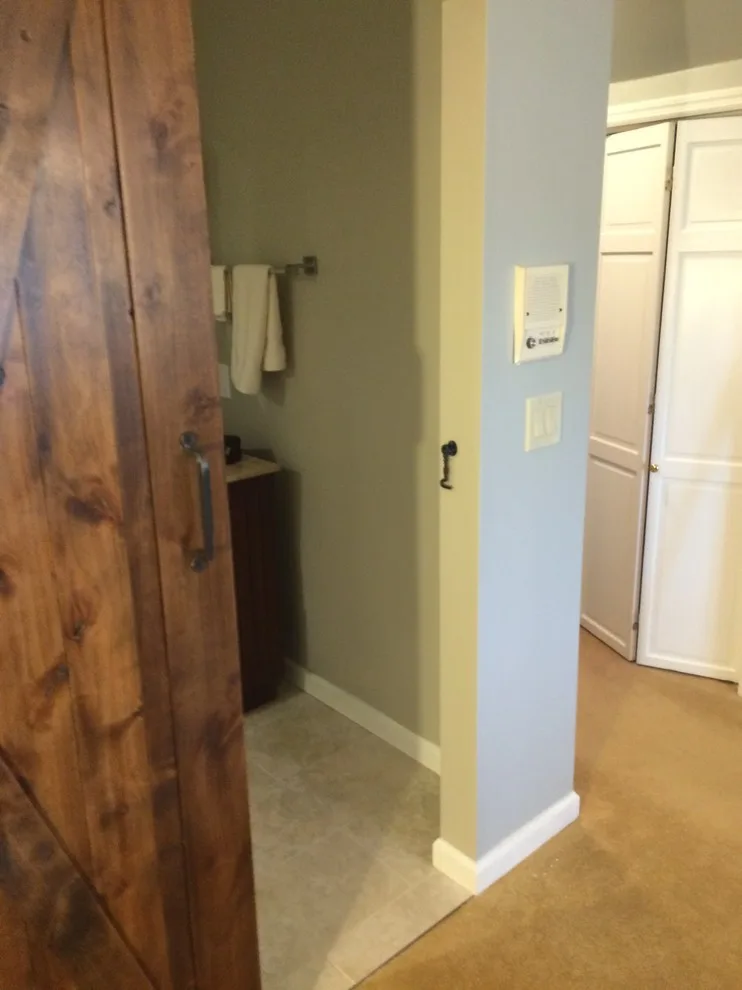 Bathroom featuring a sliding barn door by Embark Project Services, LLC - Photo 11